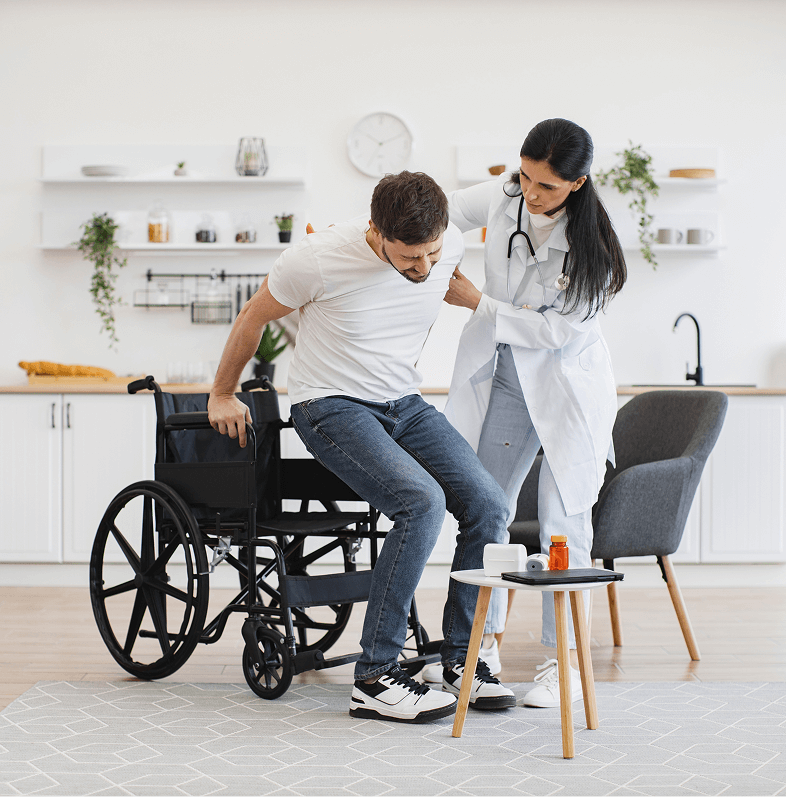 Amputee physical therapy care in Fort Lee — therapist assisting patient with wheelchair mobility